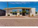 Stylish condo with modern architectural features, desert landscaping, and blue skies at 102 W Maryland Ave # B2, Phoenix, AZ 85013