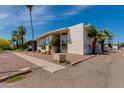 Modern condo with well maintained desert landscaping and a clear blue sky at 102 W Maryland Ave # B2, Phoenix, AZ 85013