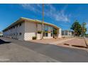 A modern condo building with updated exterior and mature landscaping at 102 W Maryland Ave # B2, Phoenix, AZ 85013