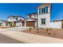Two-story home with a three-car garage, desert landscaping, and close proximity to neighboring houses at 10229 N 49Th Dr, Glendale, AZ 85302