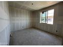 Bright bedroom with a large window offering plenty of natural light at 2328 E Spur Dr, San Tan Valley, AZ 85140