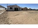 A new home under construction, shown with building materials, in a neighborhood at 2328 E Spur Dr, San Tan Valley, AZ 85140