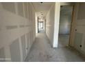 Spacious hallway with white walls leading to a bright, open living area at 2328 E Spur Dr, San Tan Valley, AZ 85140