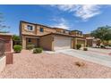 A charming two-story home with desert landscaping at 2565 E Southern Ave # 130, Mesa, AZ 85204
