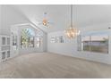Bright and airy living room with high ceilings, large windows, and a chandelier at 2821 E Pontiac Dr, Phoenix, AZ 85050