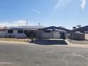 Well-maintained single-story home featuring covered parking and secure, fenced yard at 3127 N 38Th Dr, Phoenix, AZ 85019