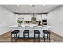 Spacious kitchen island with seating, perfect for casual dining and entertaining guests at 31345 N 130Th Ave, Peoria, AZ 85383