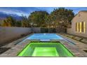 Gorgeous pool and spa featuring fountains and color lighting, perfect for relaxation at 4300 S Marble St, Gilbert, AZ 85297