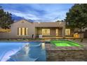 Beautiful backyard pool and spa featuring color lighting, fountains, and a resort-style lounge at 4300 S Marble St, Gilbert, AZ 85297