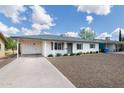 Charming single story home with desert front landscaping and carport at 5328 E Yale St, Phoenix, AZ 85008