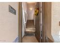 Warm and inviting entryway featuring a staircase and a decorative wreath on the front door at 705 W Queen Creek Rd # 2126, Chandler, AZ 85248