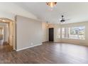 Inviting living room boasts wood-look tile flooring and large windows for natural light at 1061 E Linda Ln, Gilbert, AZ 85234