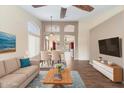 Inviting living room features stylish decor, a dining area, and warm wood flooring at 1061 E Linda Ln, Gilbert, AZ 85234
