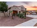 Charming two-story home featuring desert landscaping and a tile roof with a three car garage at 12300 N 142Nd Ln, Surprise, AZ 85379