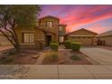 Charming two-story home with an attached two-car garage and low maintenance desert landscaping at 12473 W Montgomery Rd, Peoria, AZ 85383