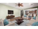 Inviting living room with neutral colors, comfortable seating, and plenty of space for relaxing at 12473 W Montgomery Rd, Peoria, AZ 85383