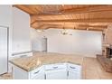 Bright kitchen featuring granite counters, modern appliances, and brick fireplace at 1316 N Spring Cir, Mesa, AZ 85203