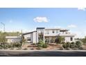 Modern two-story home with desert landscaping, showcasing clean lines and a welcoming entrance at 17837 W Estes Way, Goodyear, AZ 85338