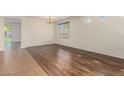 Spacious living room featuring beautiful hardwood floors and bright natural light at 1867 S Seton Ave, Gilbert, AZ 85295