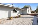 Charming home featuring a brick-paved entrance, xeriscaping and a well-maintained exterior at 2045 N 68Th St, Scottsdale, AZ 85257
