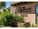 Exterior sign for La Verne Luxury Condominiums with lush desert landscaping at 20660 N 40Th St # 2016, Phoenix, AZ 85050