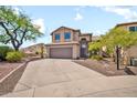 Inviting two-story home boasts mature trees, desert landscaping and a two-car garage at 3854 E Cathedral Rock Dr, Phoenix, AZ 85044