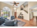 Inviting living room with vaulted ceilings, neutral tones and terracotta tile flooring at 3854 E Cathedral Rock Dr, Phoenix, AZ 85044