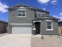 Charming two-story home with neutral stucco exterior, well-manicured landscaping, and a spacious two car garage at 47748 W Moeller Rd, Maricopa, AZ 85139