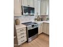 Kitchen features modern stainless steel oven, microwave, and white cabinetry at 5011 E Nisbet Rd, Scottsdale, AZ 85254
