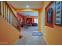 Inviting entryway featuring tile flooring and an open staircase to the upper level at 5425 W Harwell Rd, Laveen, AZ 85339
