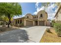 Charming two-story home with a spacious driveway and well-maintained desert landscaping at 5425 W Harwell Rd, Laveen, AZ 85339