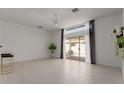Bright living room featuring a sliding glass door leading to an outdoor seating area at 7006 E Jensen St # 40, Mesa, AZ 85207
