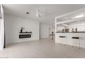 Spacious living room featuring a modern fireplace and open access to the kitchen at 7006 E Jensen St # 40, Mesa, AZ 85207