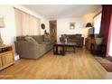 Inviting living room with wood laminate flooring and comfortable seating area at 7807 E Main St # F-35, Mesa, AZ 85207
