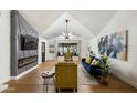Bright living room with vaulted ceilings, modern fireplace, stylish furnishings, and large windows at 8419 E Rancho Vista Dr, Scottsdale, AZ 85251