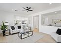 Inviting living room featuring an open layout and contemporary furnishings at 9110 W Palm Ln, Phoenix, AZ 85037