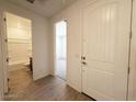 Bright entryway showcasing a tiled floor with views of a bathroom and bedroom at 9547 W Parkway Dr, Tolleson, AZ 85353