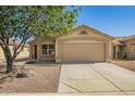Charming single-story home with a well-manicured yard and a two-car garage at 11359 E Elena Ave, Mesa, AZ 85208