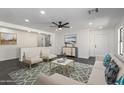 Bright living room features modern furniture, neutral decor, and stylish rug, creating a welcoming atmosphere at 11359 E Elena Ave, Mesa, AZ 85208