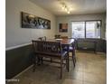 Eat-in dining room featuring neutral paint, a window, and tile flooring at 1209 W Tulane Dr, Tempe, AZ 85283