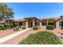 Inviting home exterior featuring a walkway, desert landscaping, and a charming covered entrance at 13608 W Aleppo Dr, Sun City West, AZ 85375