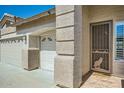 Exterior home details: decorative security door with a wolf and moon design at 15211 N 184Th Ct, Surprise, AZ 85388