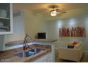 Inviting living area with neutral tones, colorful accents, and a functional, open layout at 1701 E Colter St # 280, Phoenix, AZ 85016