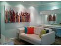 Cozy living room area with stylish sofa, modern art, and a bright, welcoming atmosphere at 1701 E Colter St # 280, Phoenix, AZ 85016