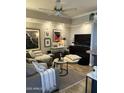 Inviting living room featuring modern decor, plush sofa, stylish accents, and entertainment center at 1701 E Colter St # 280, Phoenix, AZ 85016