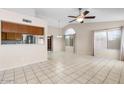 Spacious living room with lots of natural light, tile floors, and an open layout at 17912 N 88Th Dr, Peoria, AZ 85382