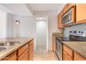 Modern kitchen featuring stainless steel appliances and a convenient layout with ample counter space at 200 E Southern Ave # 222, Tempe, AZ 85282