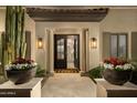Welcoming entryway with stone columns, decorative planters, and a view into the open floor plan at 22406 N 36Th Way, Phoenix, AZ 85050