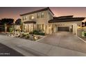 Charming home features desert landscaping, a porte-cochère, and a spacious driveway at 22406 N 36Th Way, Phoenix, AZ 85050