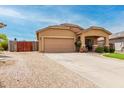 Welcoming single-level house featuring a two-car garage, inviting porch, and low-maintenance landscaping for easy living at 36064 N Murray Grey Dr, San Tan Valley, AZ 85143